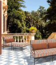 Poltrona_Lounge_Igea_Ambientata_Con_Pouf.png